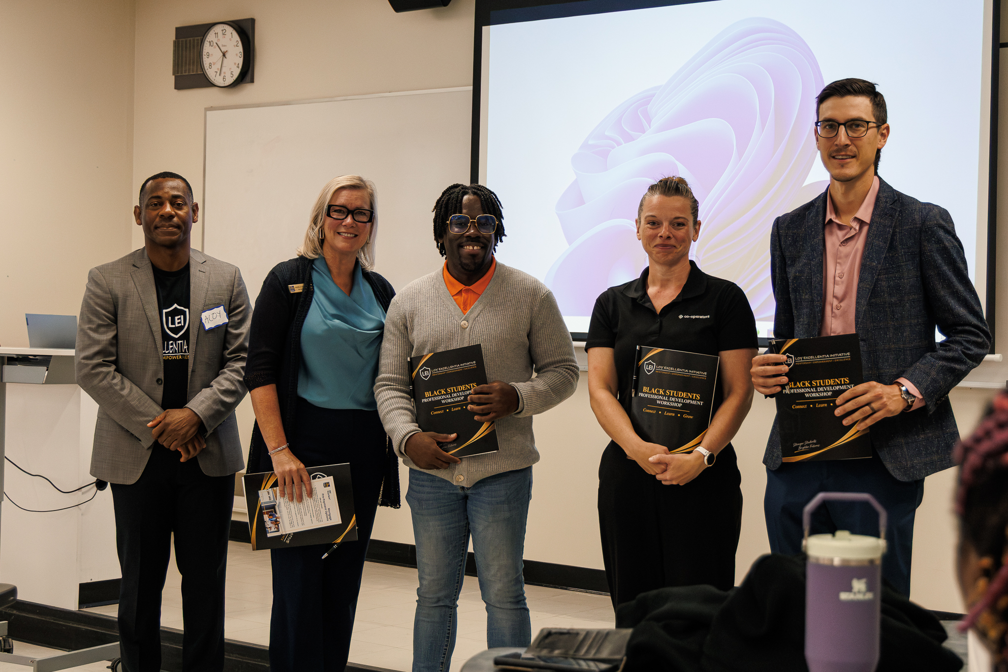 Dr. Aloysius C. Anyichie with Angela Hainsworth, Jordan Nunes, Barb Cameron and Brodie Gobin holding certificates of appreciation at the Loy Excellentia professional development workshop.