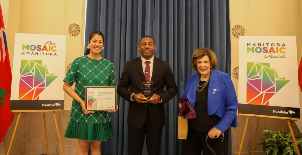 Dr. Aloysius Anyichie with Minister Malaya Marcelino and Lieutenant Governor Anita Neville at the 2026 Manitoba Mosaic Awards.