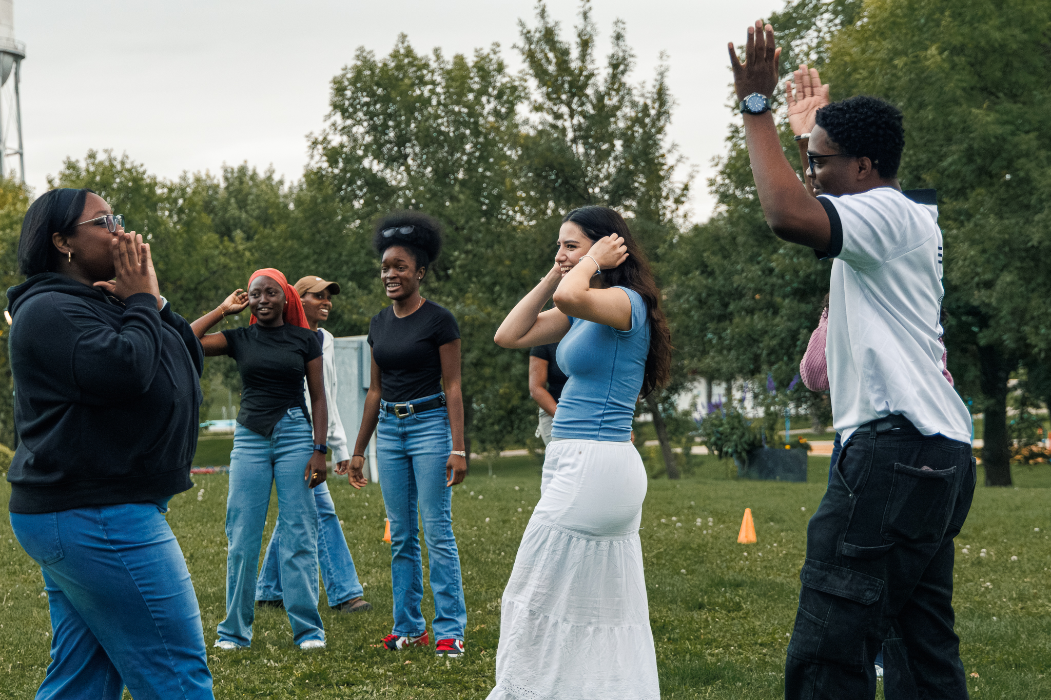 Students laughing and chatting together during the 2026 Loy Excellentia Picnic in Brandon, Manitoba.