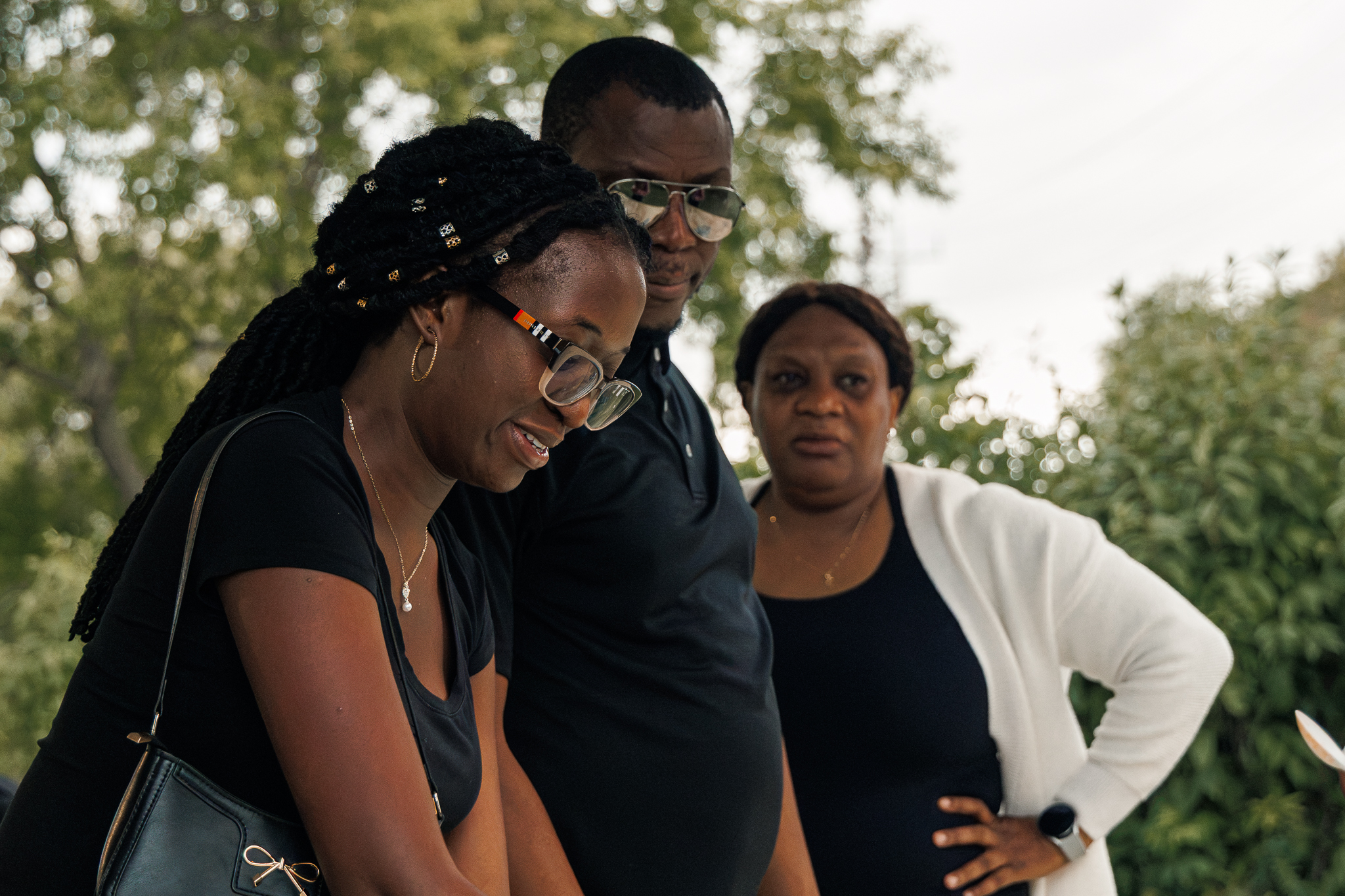 Loy Excellentia Picnic Planning Committee members Chinyere Odu, Collins Chiaka and Stella Akomolafe sharing a candid moment at the 2026 picnic.