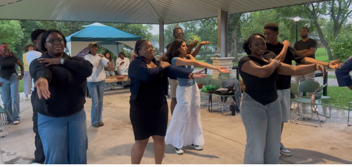 Students dancing together during a group dance activity at the 2026 Loy Excellentia Picnic in Brandon, Manitoba.